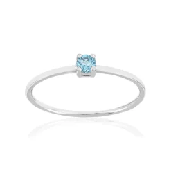 Bague or 375 blanc topaze bleue traitée