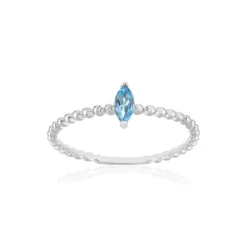 Bague or 375 blanc topaze bleue traitée