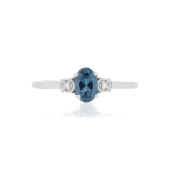 Bague or blanc 375 topaze bleue traitée diamants