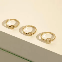 Bague or 750 jaune boucle et demi-tour diamants