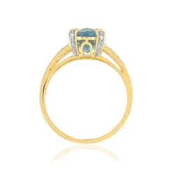 Bague or 375 2 tons topaze bleue traitée ovale et diamants