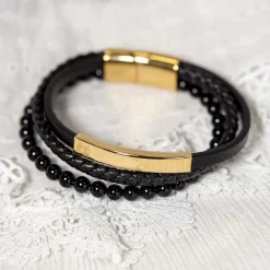 Bracelet multirang matière synthétique noire acier couleur jaune 21 cm