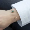 Bracelet plaqué or jaune aventurine, motif feuille. Diamètre 58 mm.