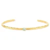 Bracelet plaqué or jaune strié pierre synthétique bleue 58 mm.
