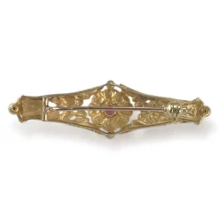 Broche d'occasion or 750 jaune doublet grenat verre
