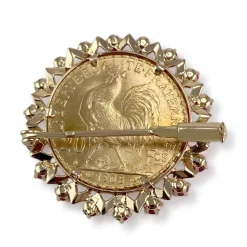 Broche d'occasion or 750 jaune porte pièce rubis synthétiques