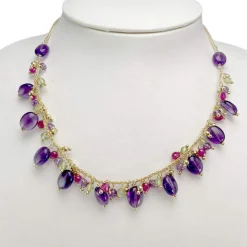 Collier d'occasion or 750 jaune boules en verre et améthystes 41 cm