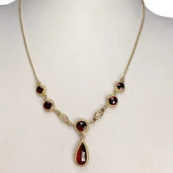 Collier d'occasion or 750 jaune maille forcat grenat