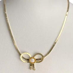 Collier d'occasion or 750 jaune perle de culture